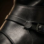 Close-up of fold-over cuff on black Noirtide pirate boot — 17-inch shaft, genuine leather, made to order