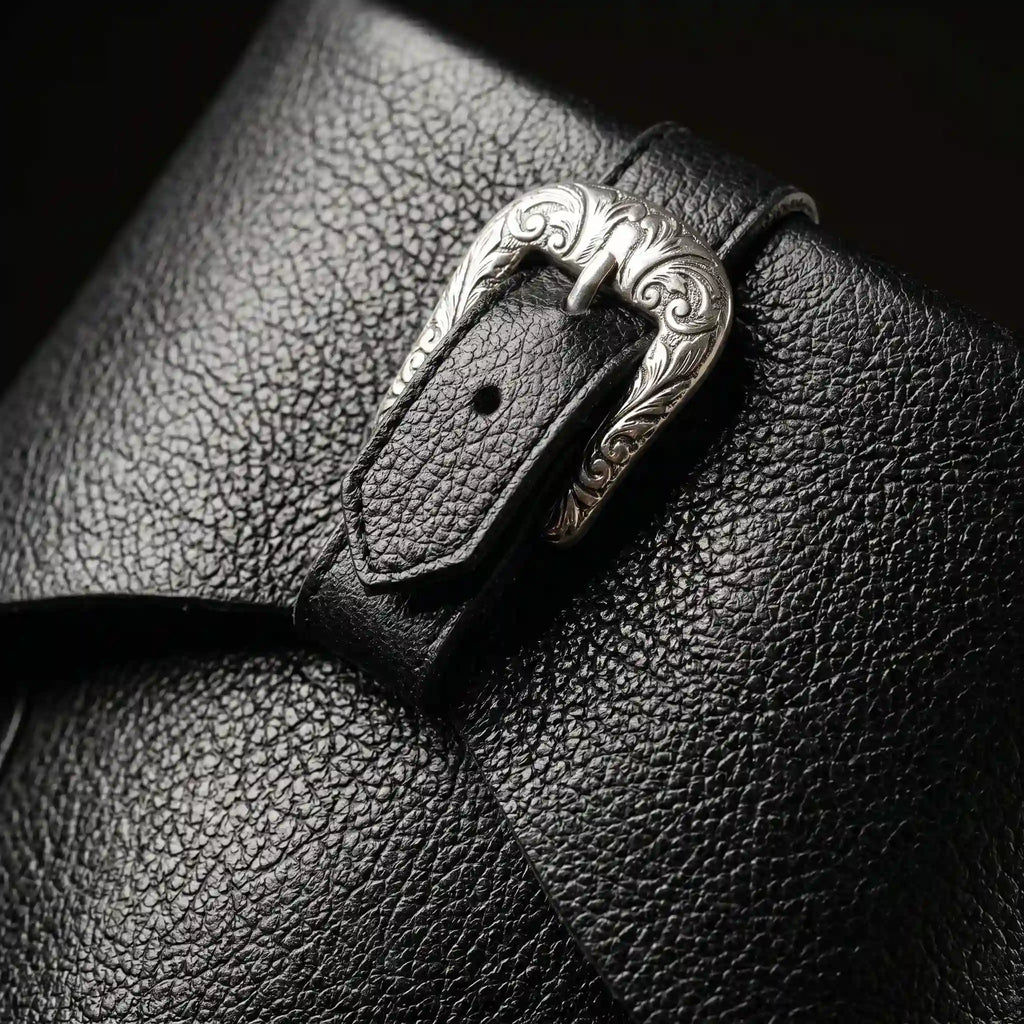 Buckle strap detail on black Noirtide Caribbean pirate boot — genuine leather, rugged maritime silhouette