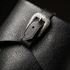 Buckle strap detail on black Noirtide Caribbean pirate boot — genuine leather, rugged maritime silhouette