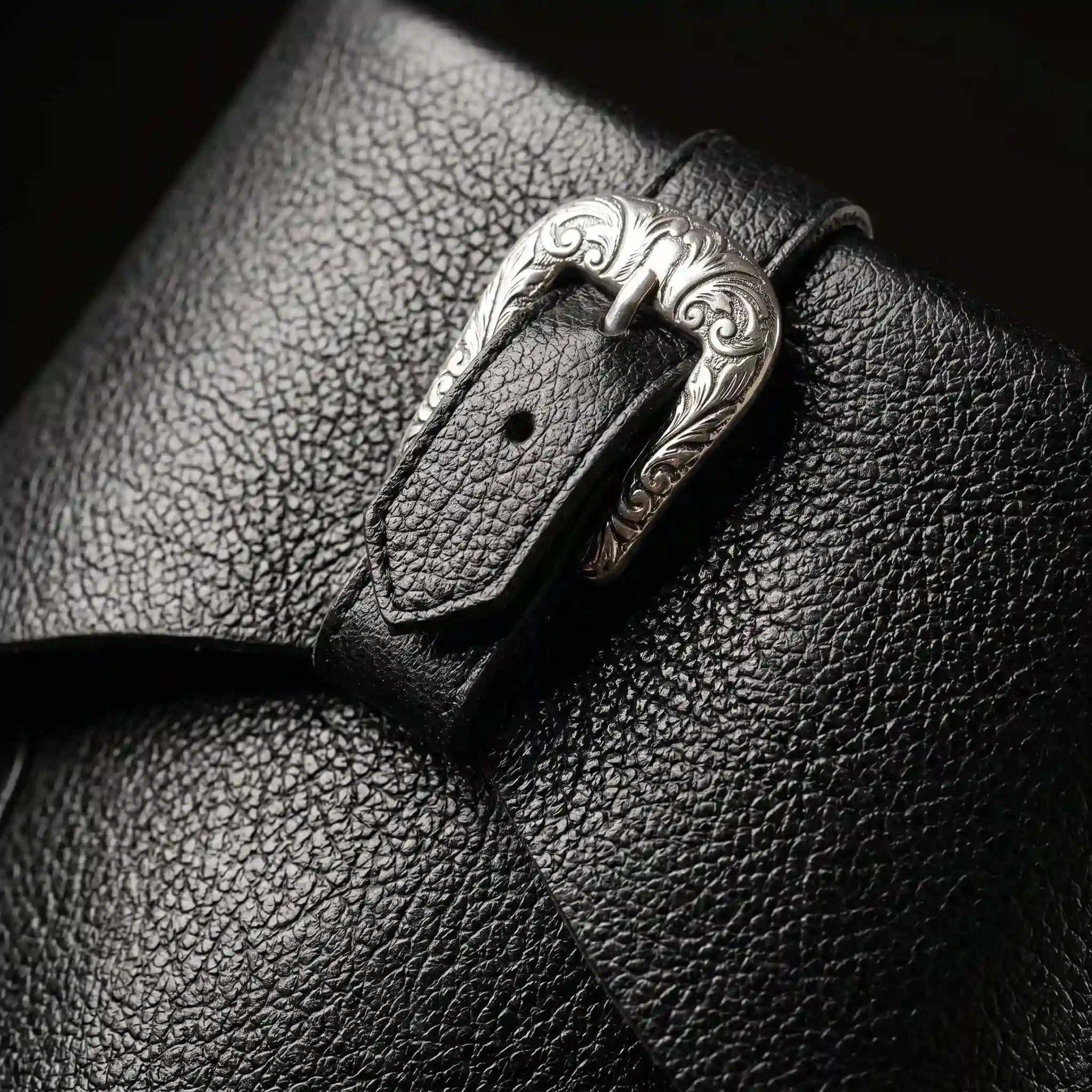 Buckle strap detail on black Noirtide Caribbean pirate boot — genuine leather, rugged maritime silhouette