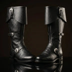Side profile of black leather Caribbean pirate boot — fold-over cuff, multi-buckle strap — Noirtide bespoke boots