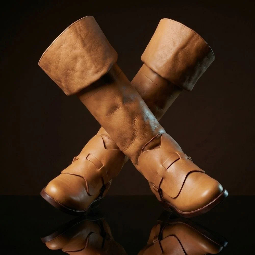 Full side view of natural tan leather Noirtide musketeer boot — wide bucket-top cuff, instep disc, pull-on construction