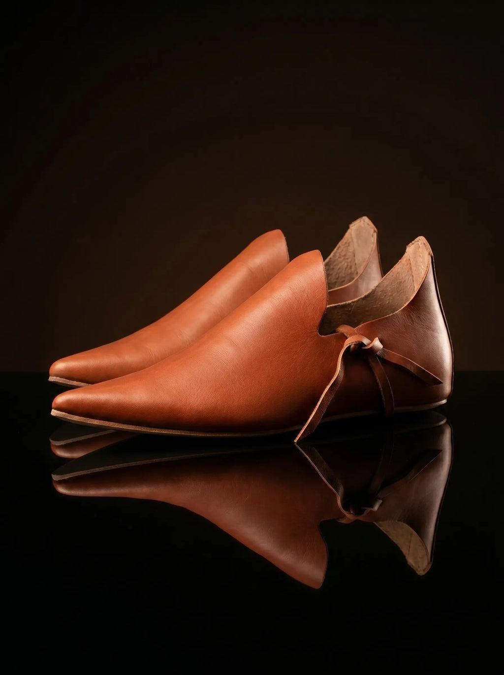 Open latchet sides on Noirtide natural tan crakow shoe — characteristic medieval open-quarter construction