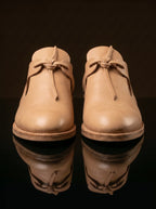Side view natural tan leather open latchet shoe — open latchet sides, welted construction — Noirtide