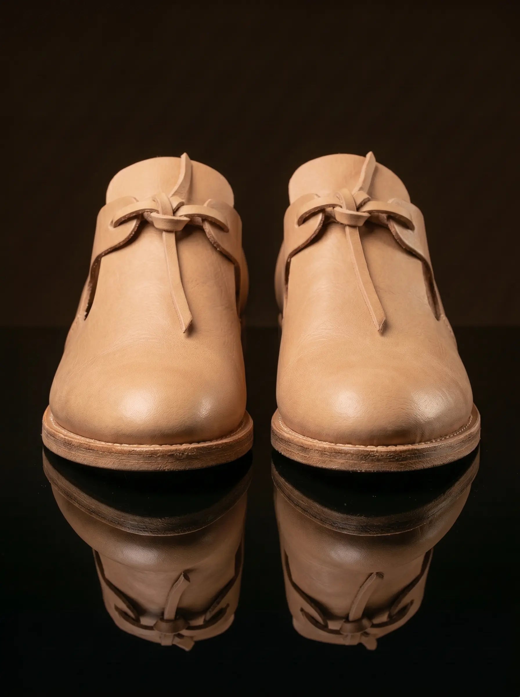 Side view natural tan leather open latchet shoe — open latchet sides, welted construction — Noirtide