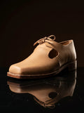 Side view natural tan leather open latchet shoe — open latchet sides, welted construction — Noirtide