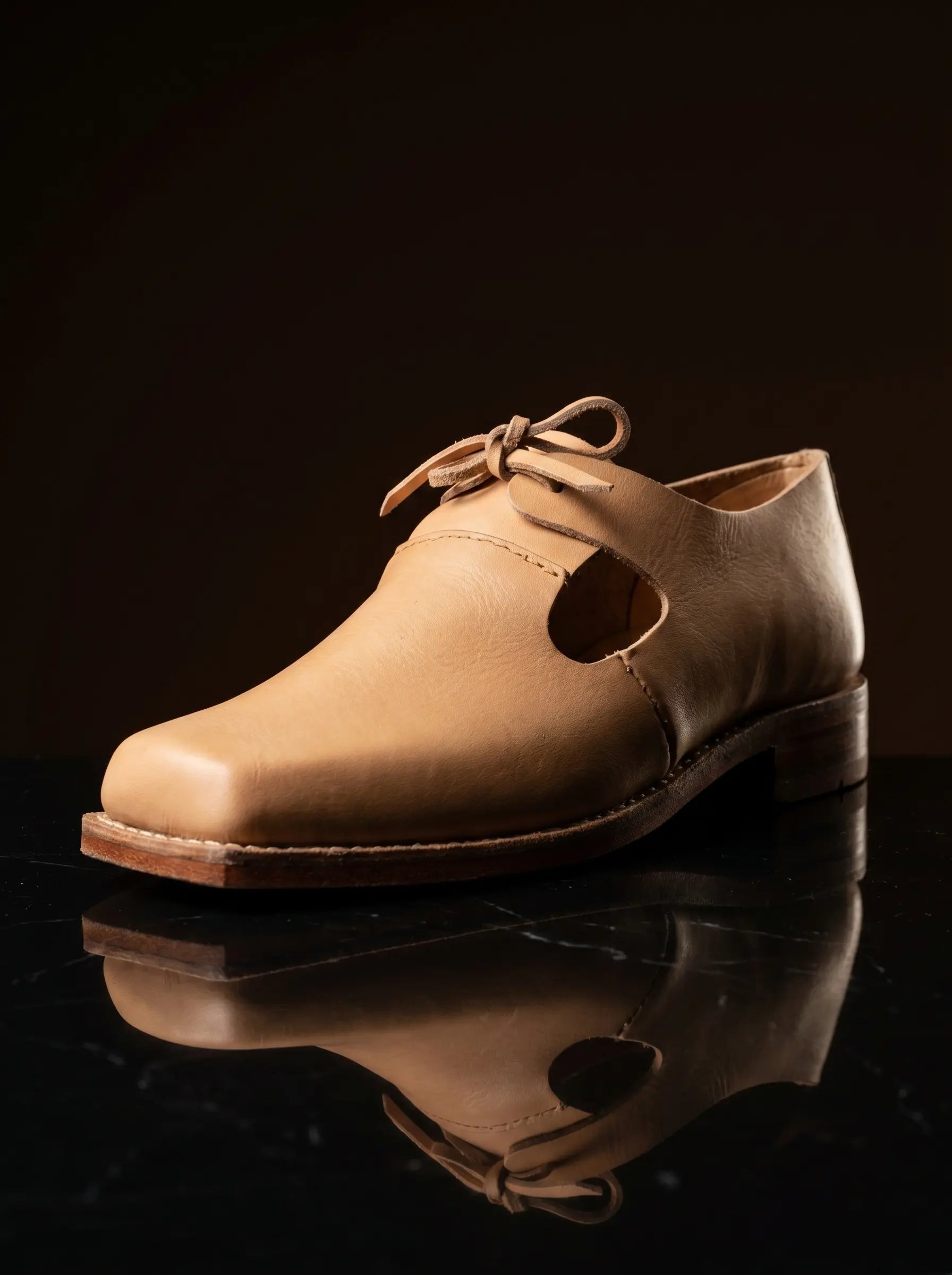Side view natural tan leather open latchet shoe — open latchet sides, welted construction — Noirtide